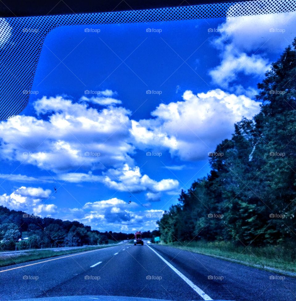 Beautiful blue sky with fluffy white clouds.