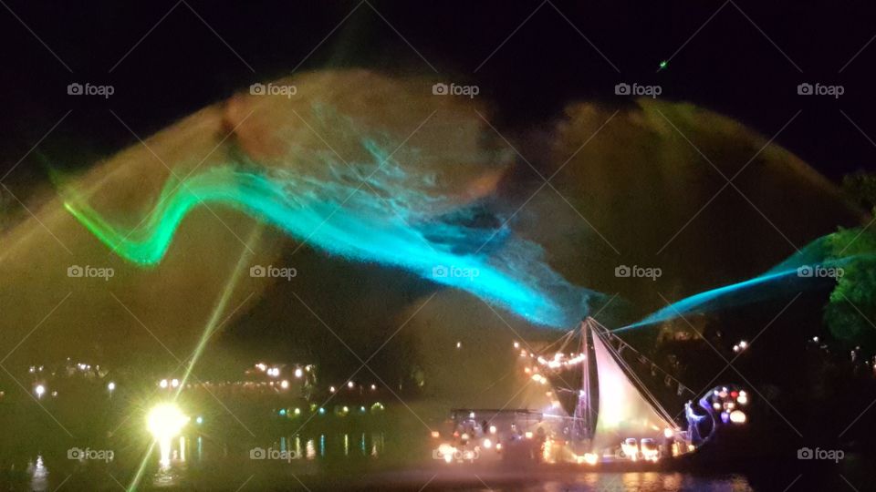 As the mist falls to the river, the might is carried into the night sky on Discovery River during Rivers of Light at Animal Kingdom at the Walt Disney World Resort in Orlando, Florida.