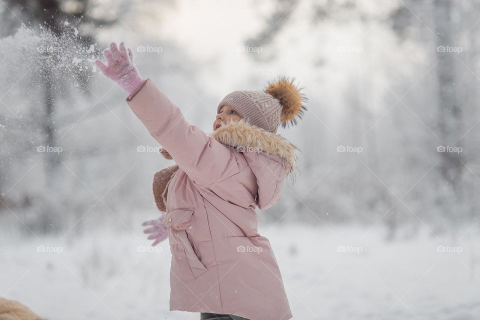 Little girl in a winter park