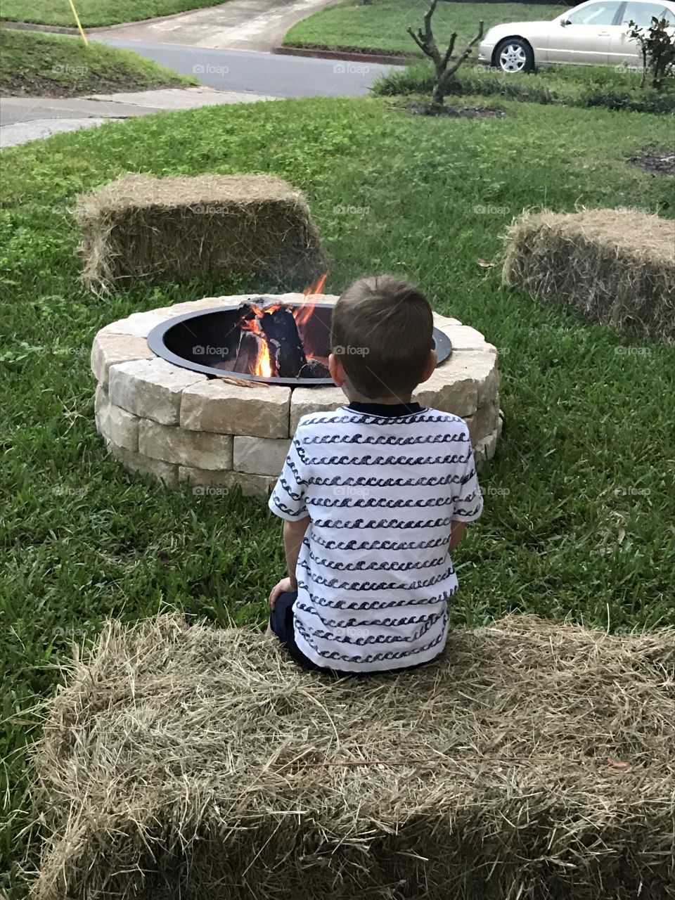 Child at a campfire 