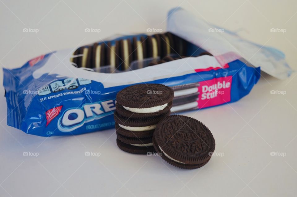 Double stuff cookies stacked in front of an open package