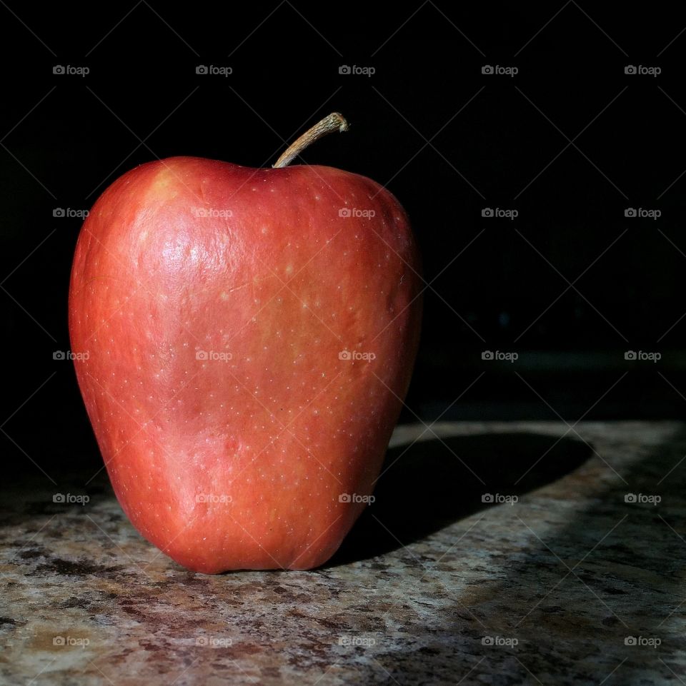 Ripe red apple in natural lighting 