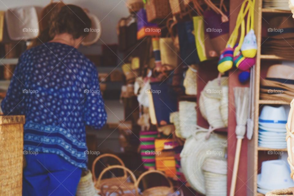 Women buying straw hat