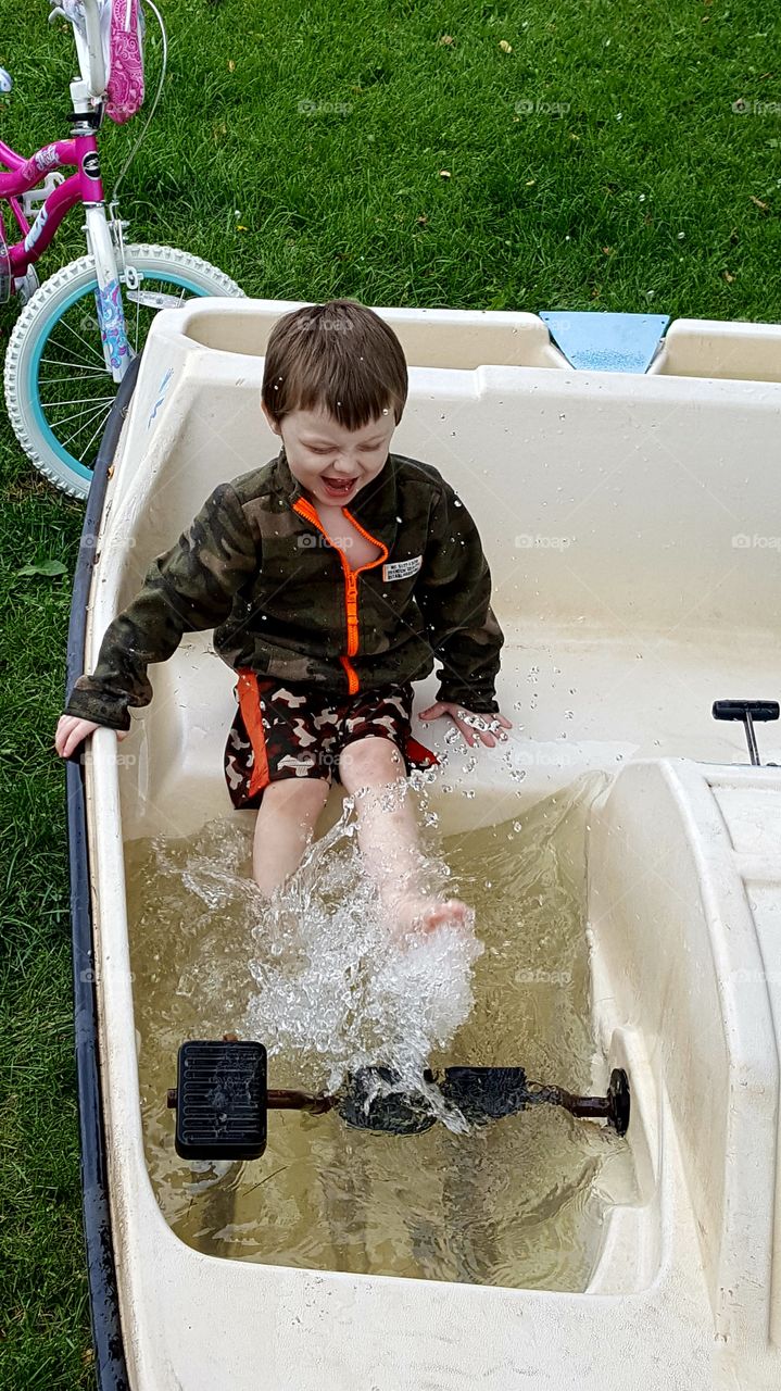 Splashing rain water in a paddle boat