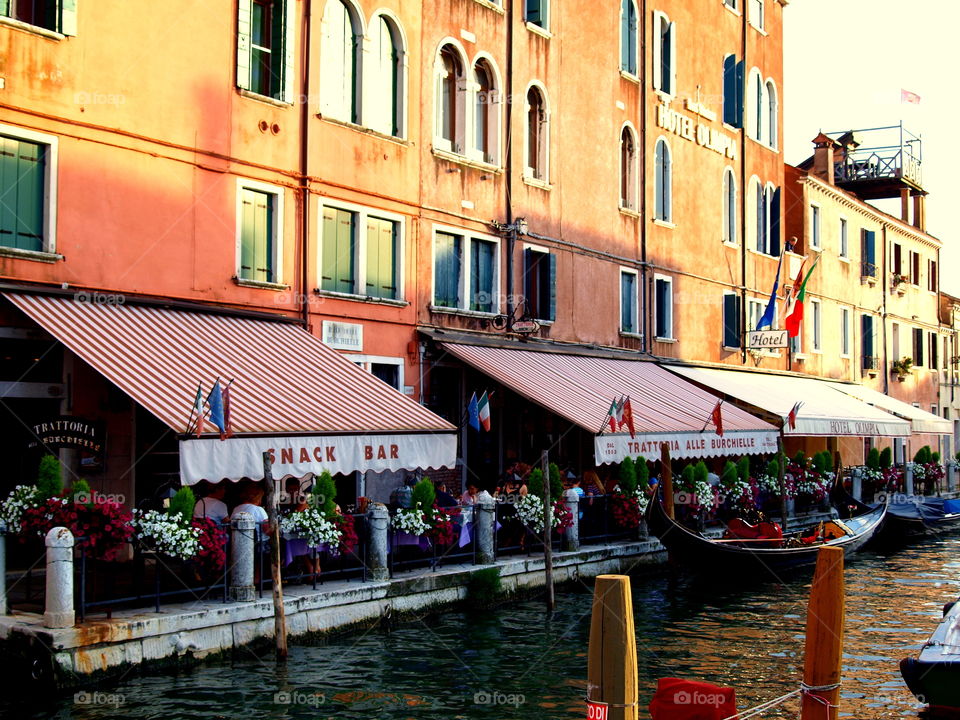 Restaurants at a canal in Venice Italy