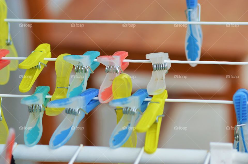 clothes pegs with yellow elements