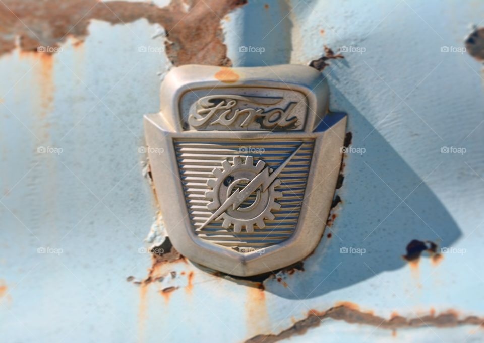Rusty vintage ford emblem 