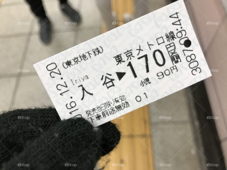 Tokyo train ticket in hand 