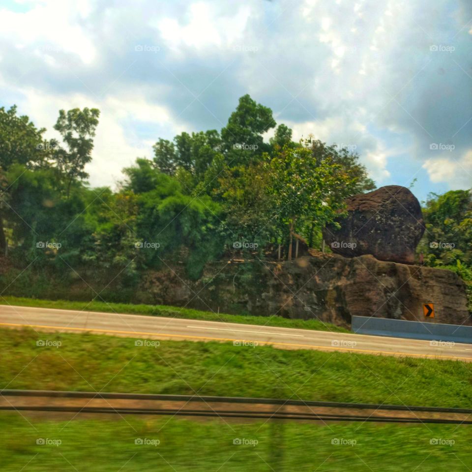 Large rock on the side of the toll road