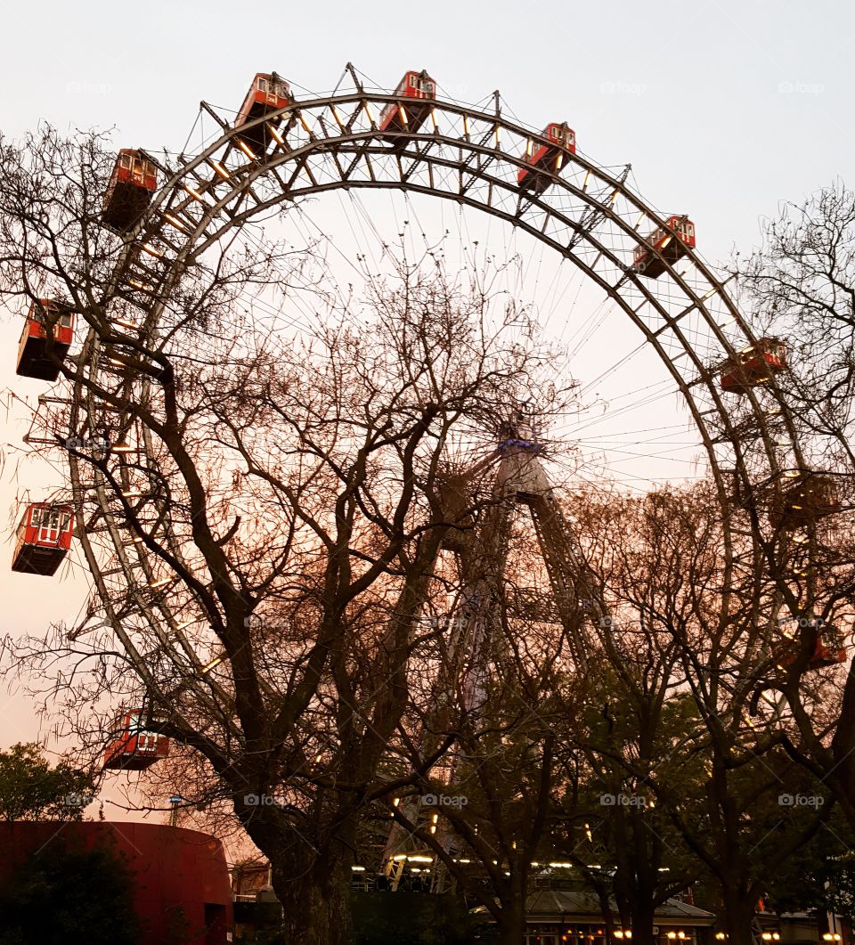 Low angle view of ferris wheel against sky at Prater