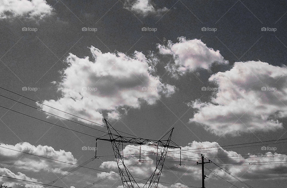 BW Summer Electric. Power pylon in front of cloudy sky