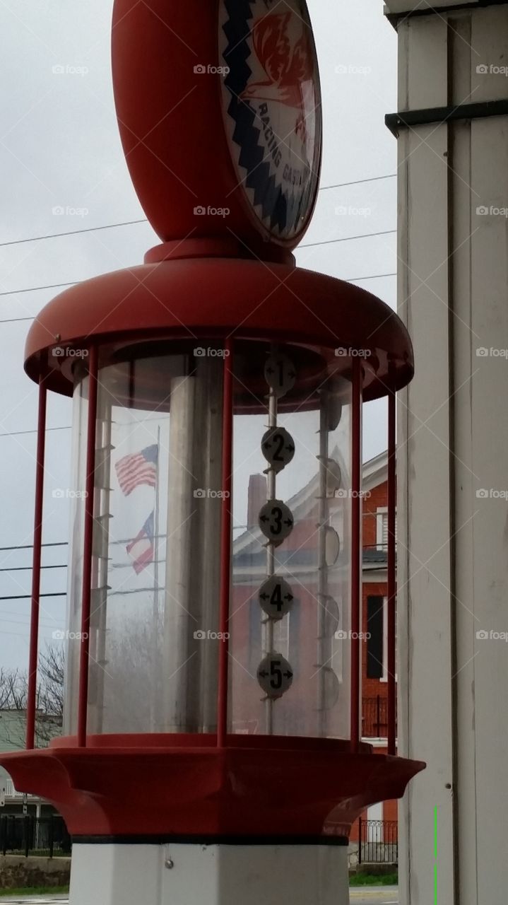 Flag through looking Glass . Found this Old gas pump in a small N Ga town and caught USA Flag in background 