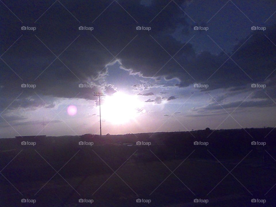 sunset soon. i took this picture up in the stands at the football field