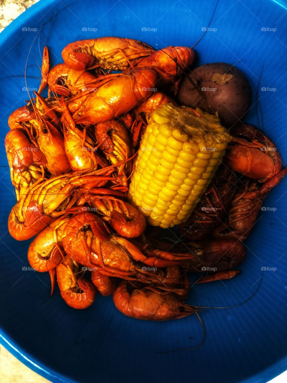 Colorful and tasty! It’s Crawfish season. This red is popping spicy and hot. Notice all the primary colors! Red, yellow, and blue. 
