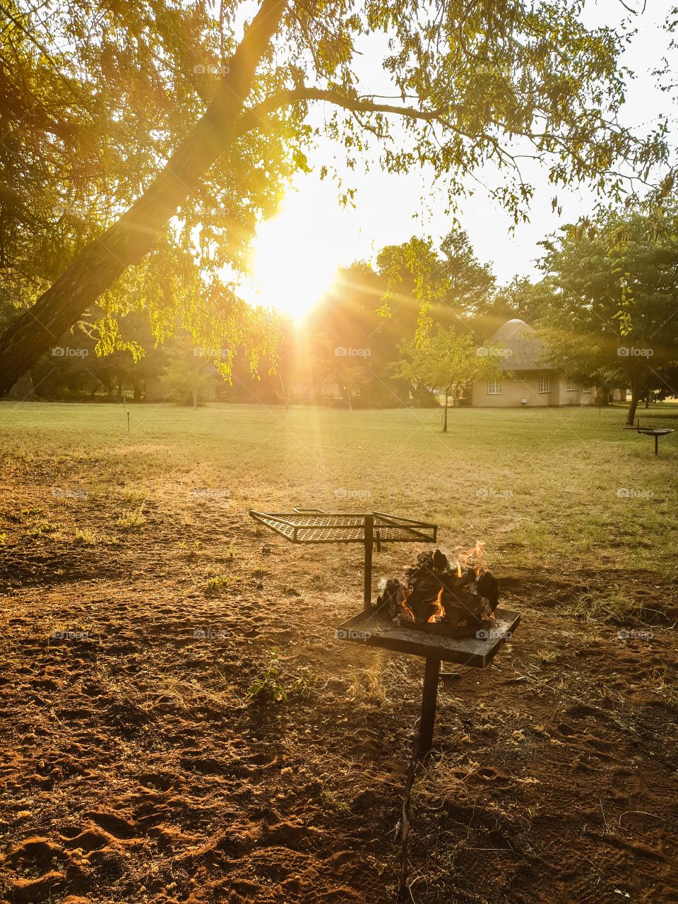 sunset with a fire in rhe foreground