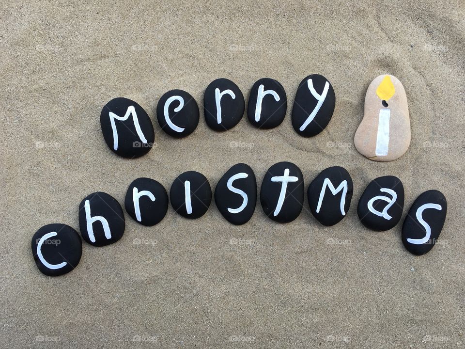 Merry Christmas on blackbpainted stones