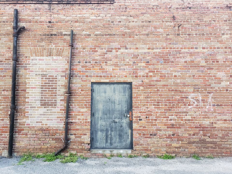 Old Door in Brick Wall
