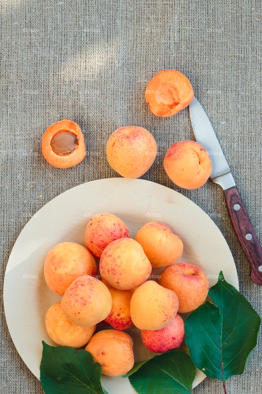Fresh apricots. Fresh apricots straight from the garden on wooden plate