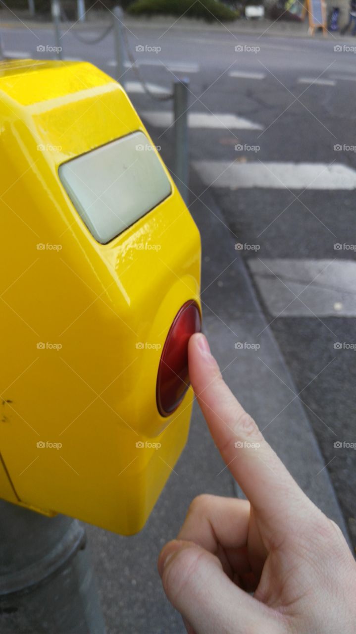 waiting for traffic light to become green, pushing the red button