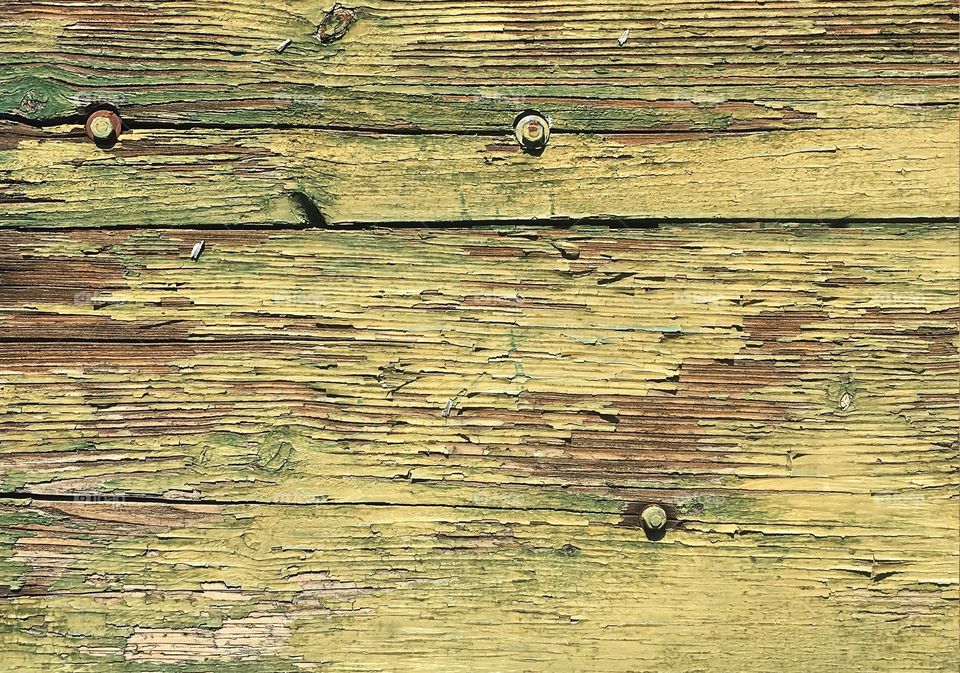 Weathered wood with chipped paint.