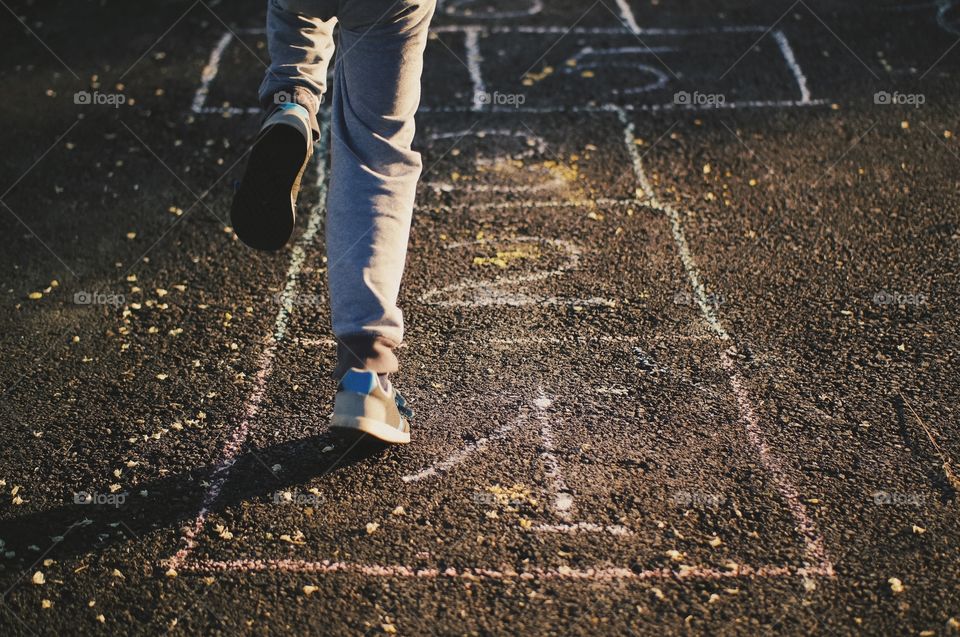 Peron playing hopscotch