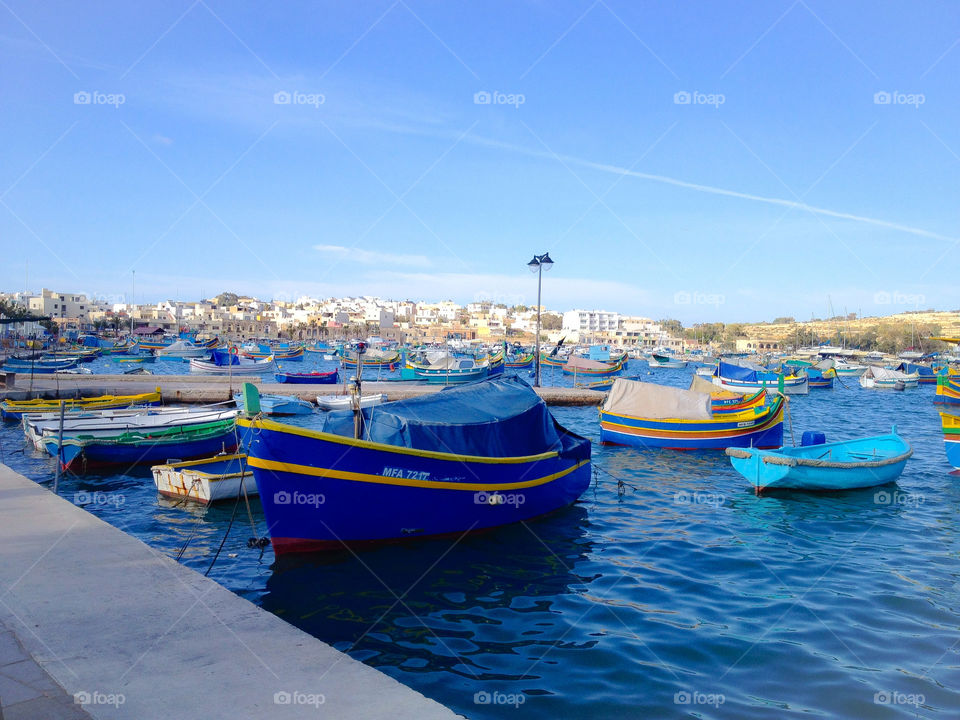 Marsaxlokk harbor with typical Maltese boats.