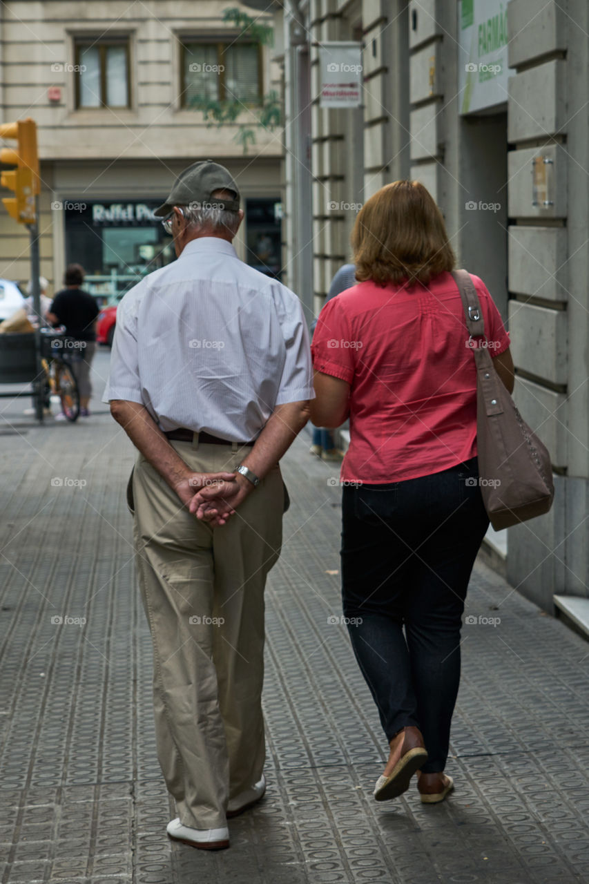 Elderly man and his assistant