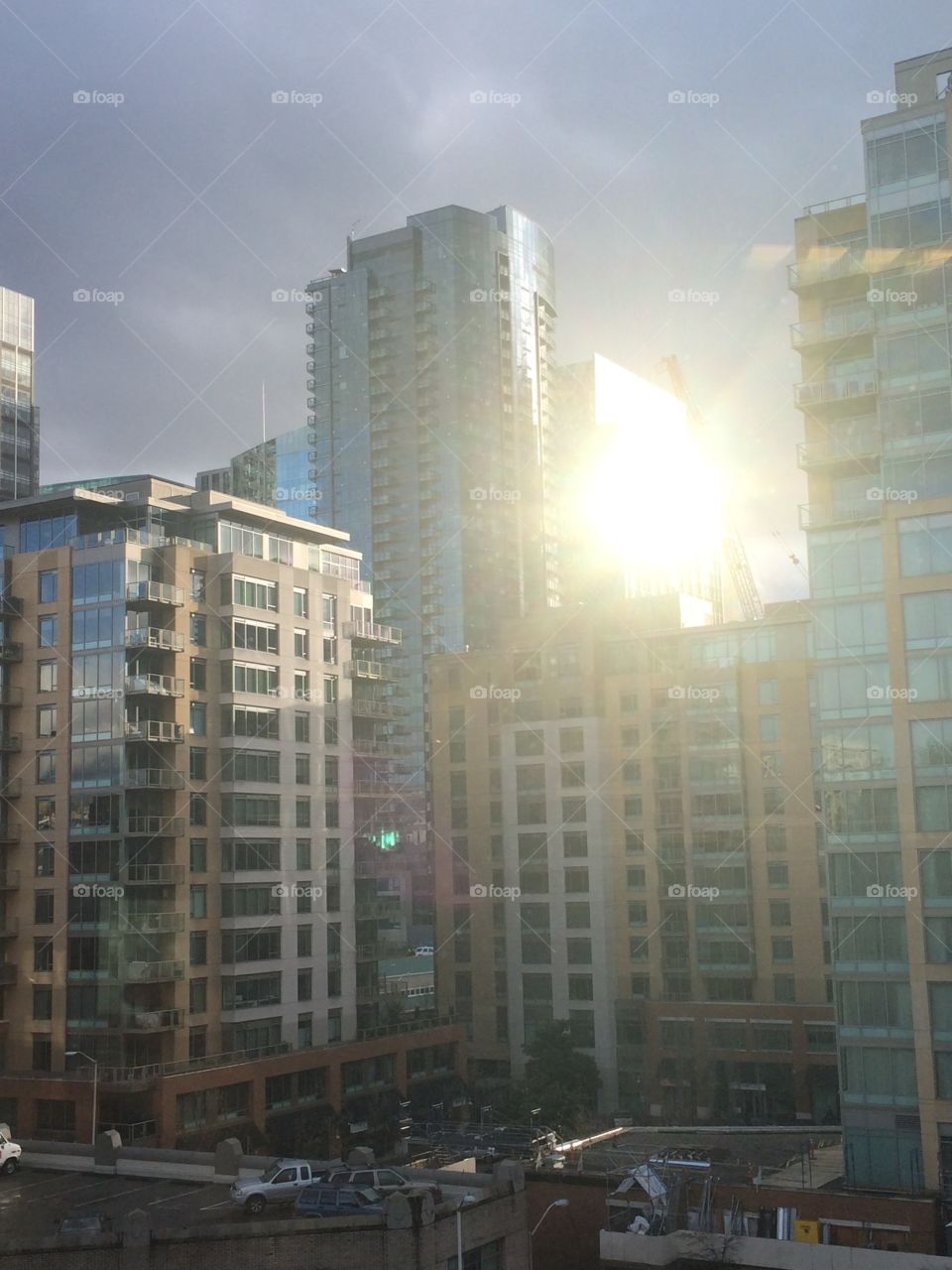 The setting sun reflecting off of sky scrapers in Seattle.