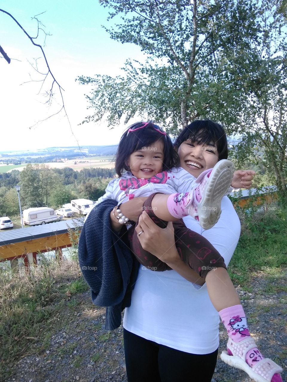 Close-up of mother carrying her daughter