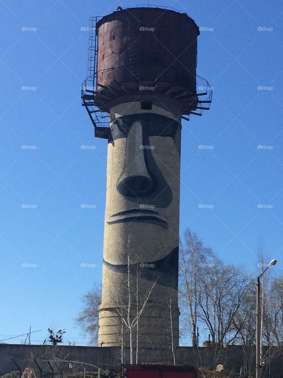 water tower in the style of Easter Island