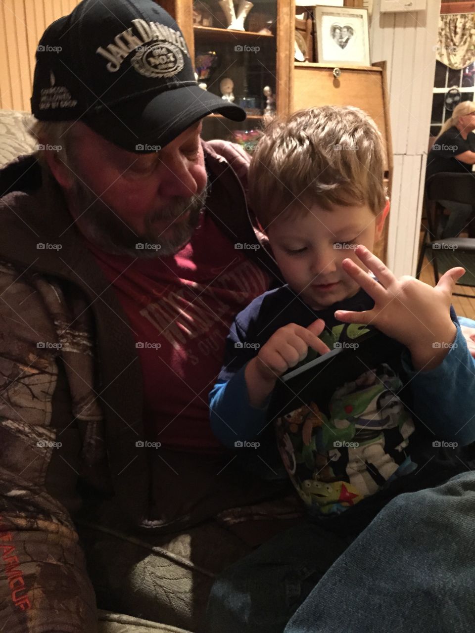 Explains technology . Mason's teaching grandpa about technology 
