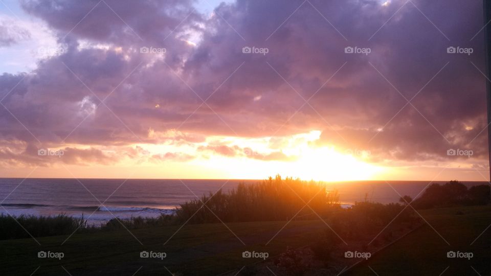 Vibrant Sunset by the tranquil seaside