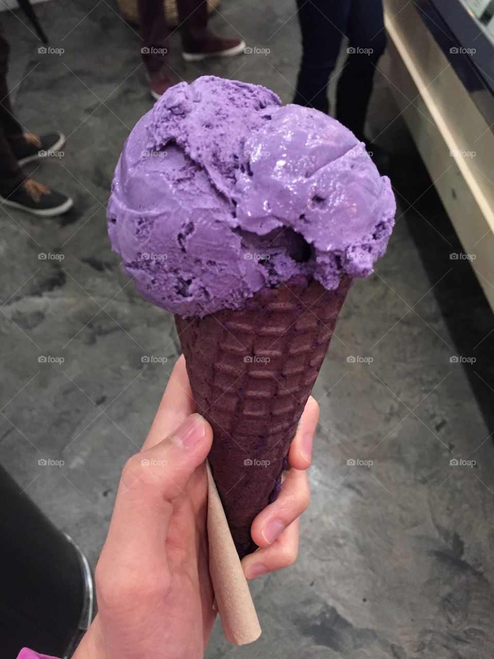 Ube ice cream on an ube cone.