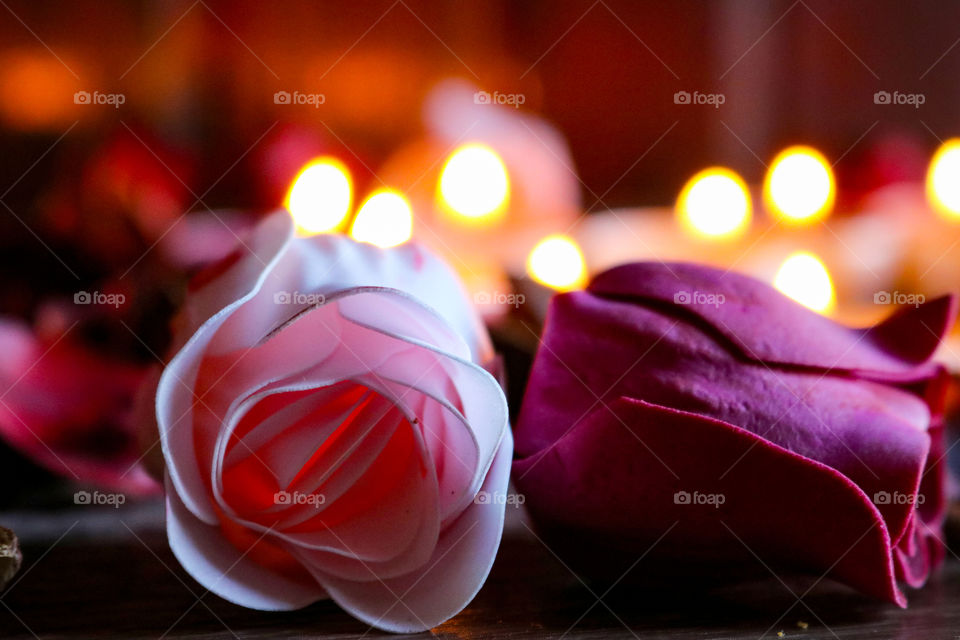 Romantic candles and pink flowers