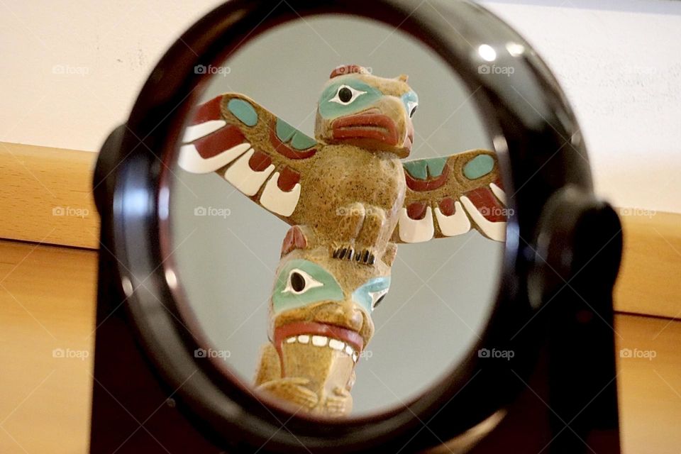 Totem pole in mirror