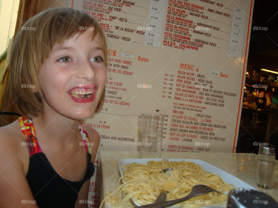 pasta happy kid eating monte carlo by sellershot