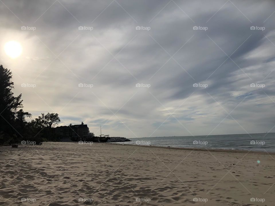 Cloudy beach day. Beautiful clouds. Sand, water and a beautiful beach. 