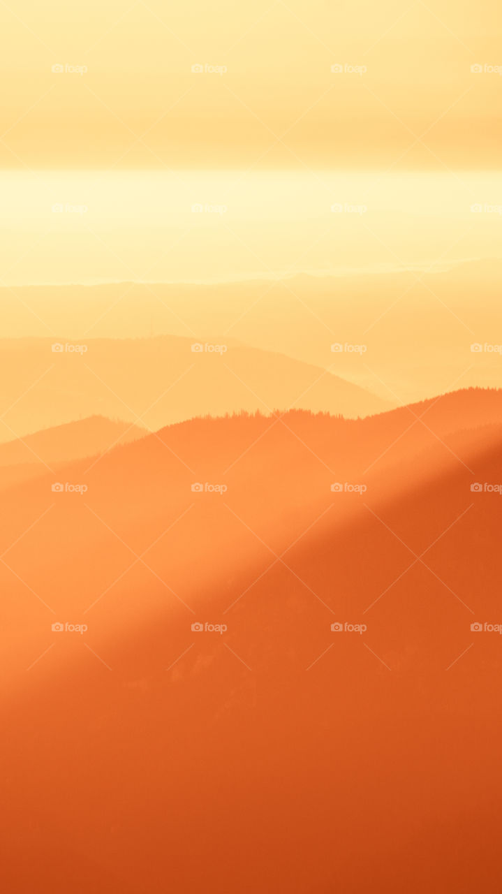 An inspiring red mountain landscape. Tatry mountains in Slovakia. A beautiful wallpaper for smartphone screen. Red abstract gradient with perspective.