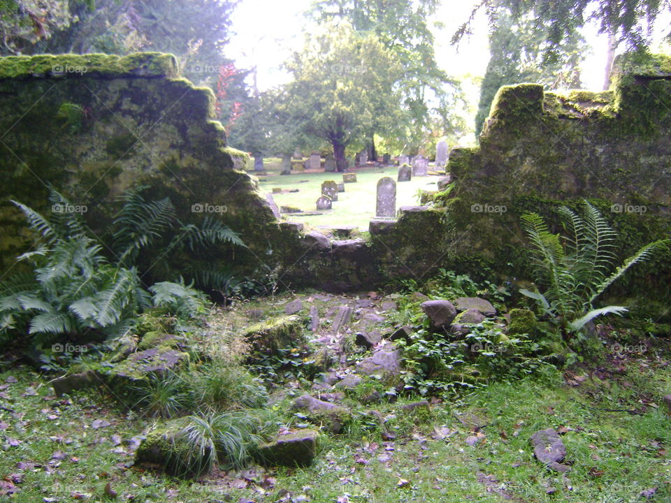graves through broken wall