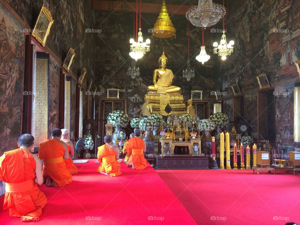 Monks praying at wat arun thailand