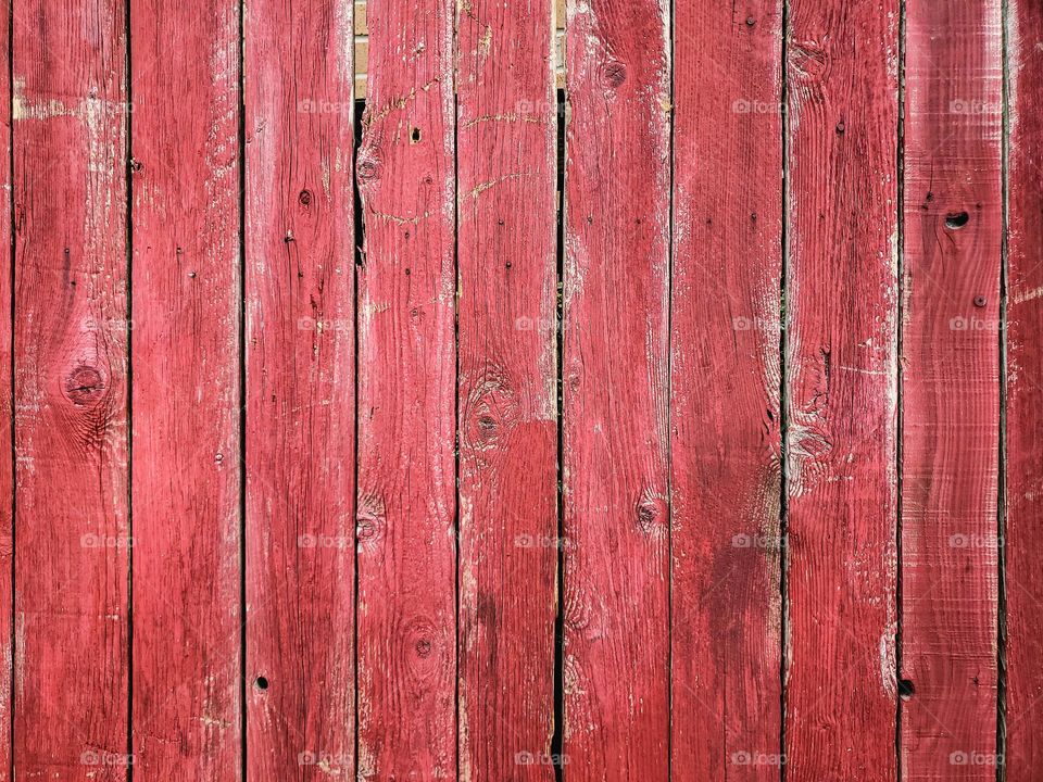 Synonymous with beautiful fall colors, distressed barn red paint on wood slats.  An excellent background for any fall photo or signage creation.