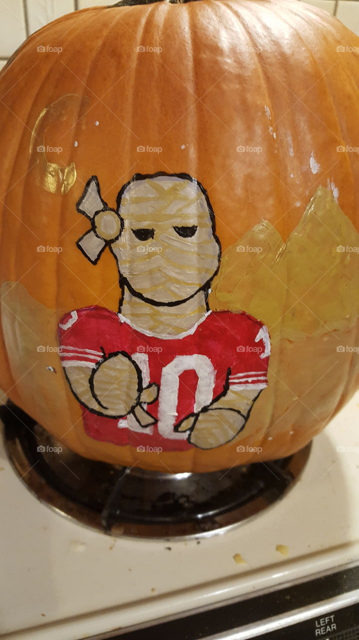 My best friend painted these legendary frights on the pumpkin as also part of our KC Chiefs football players. This is jersey #10 as the Mummy with pyramids in the background.