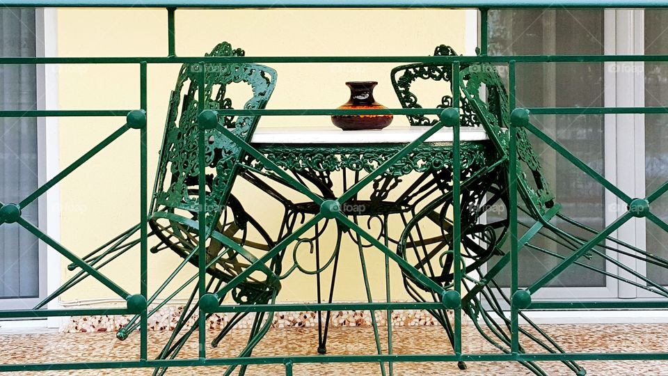 Beautiful chairs and table on the balcony