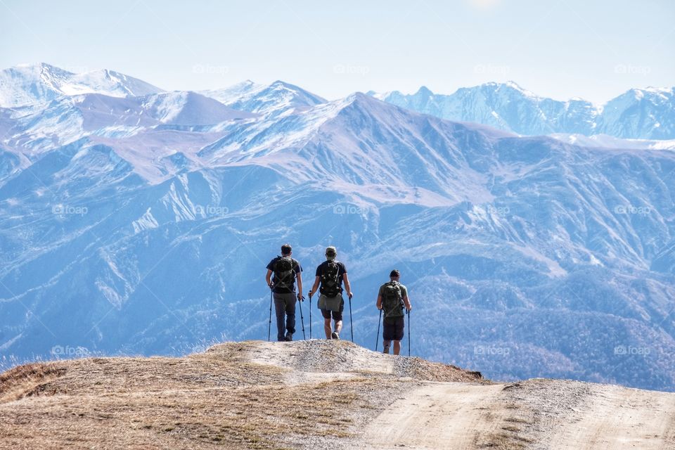 Three backpackers trekking on theirs holiday