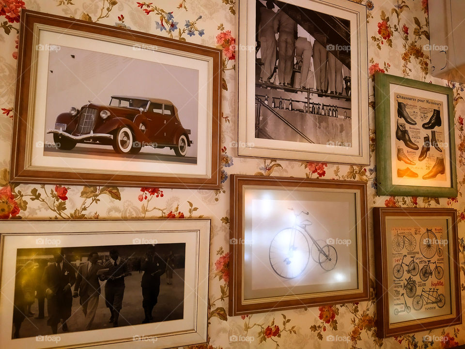 Six framed paintings on the wall