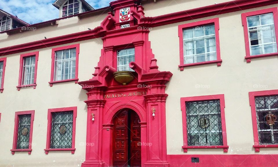 The unusually pink Palace of Justice in Puno, Peru.