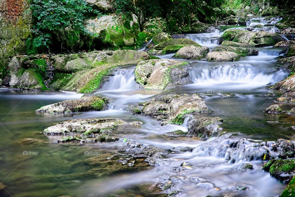 River flows between rocks