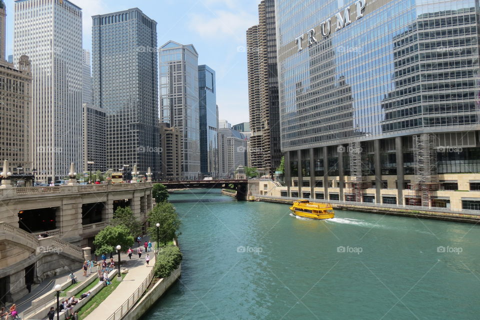 Chicago, Chicago River, Trump, Buildings, River Bank, Bridge, Modern City, Corporations, Tourism, Ferry, Hub for Major Companies, Walkway Around the River, Sunny and Bright, Urban City, Creation of Man Embraced by Mother Nature