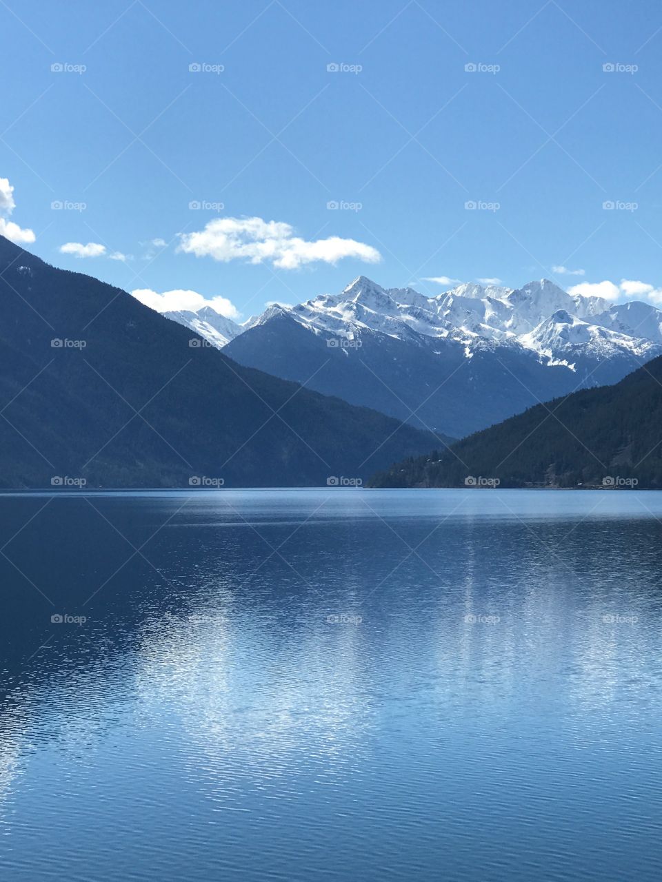 Reflection of mountain on lake during winter