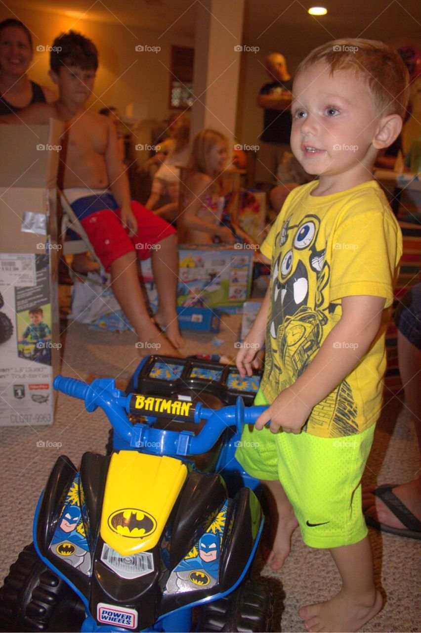 Boy playing with his toy car at home